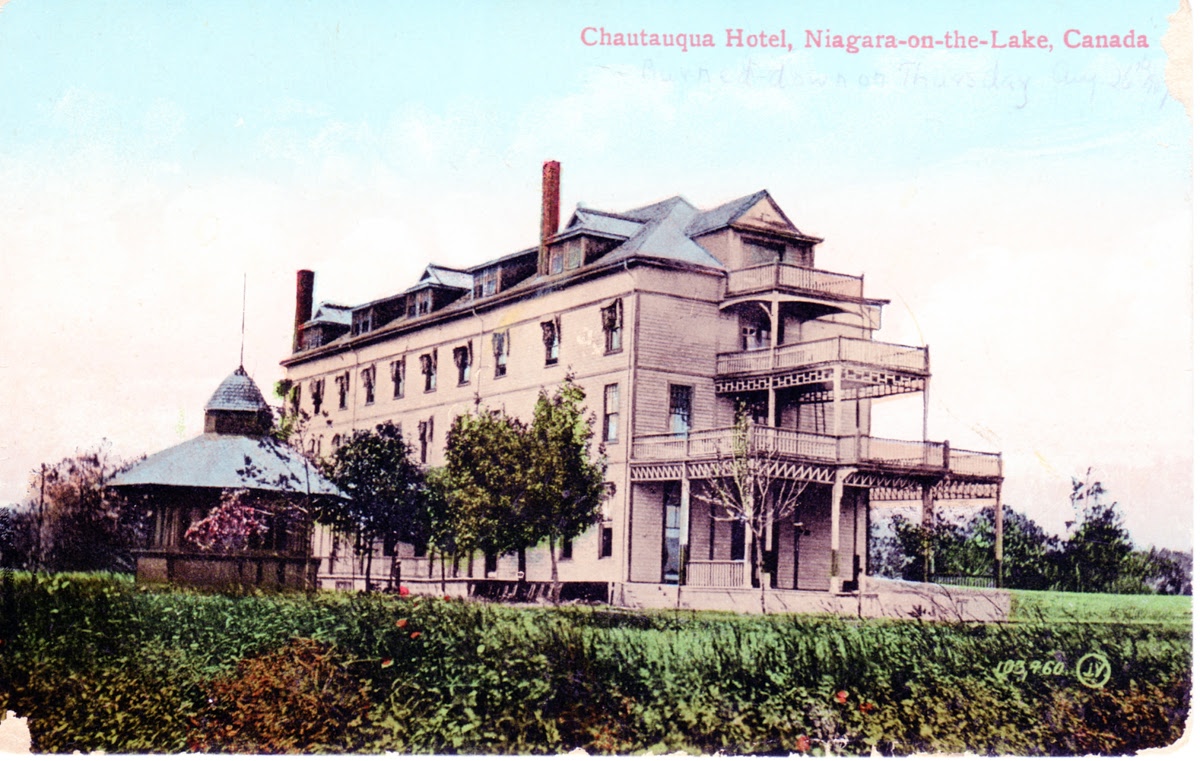Colour postcard of the multi-storey wooden Hotel Chautauqua with verandahs and a domed lakeside pavilion.
